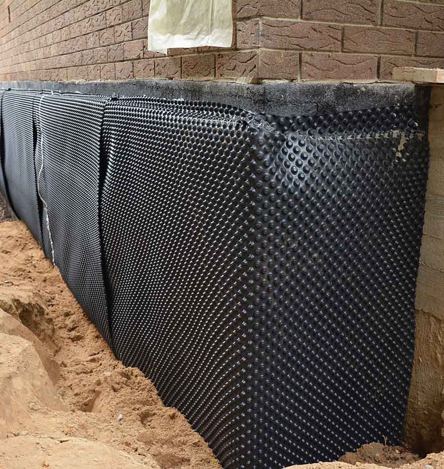 Aquatight technician installing exterior drainage